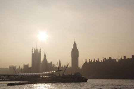 London skyline in foggy day with sun (Parliament)