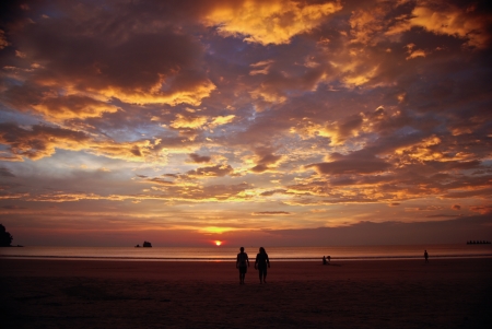 sunset on the Beach with beautiful sky and coupleの写真素材