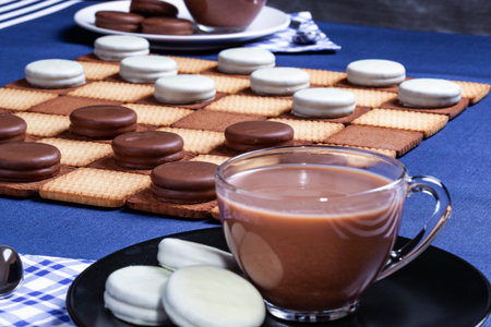 Cookies checkers and two cups of coffee