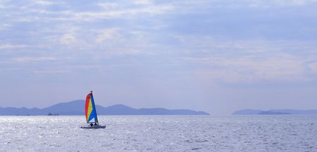 Sailing in calm waters off the coast at Pattaya, Chonburi, thailandの写真素材