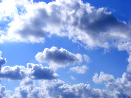 packed rain clouds in the solar rays