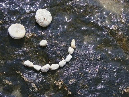 Image rights man of the stones on the dark surface of the sunの写真素材