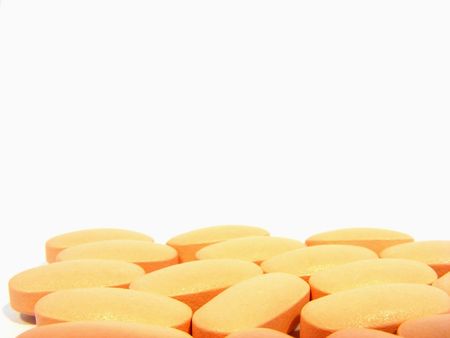 Multiple scattering pills oval pink on a white backgroundの写真素材