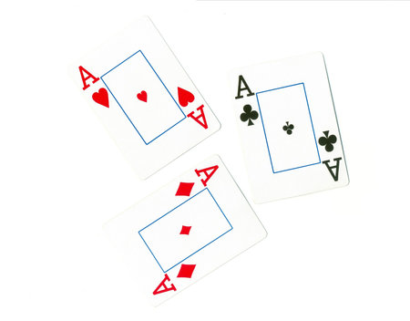 Playing cards of different colors on the table isolated on white background