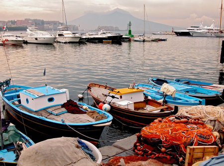 The fishing port of Naples and Vesuvius volcano as a background          の写真素材