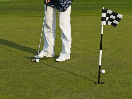Golf course with ball and flag.
の写真素材