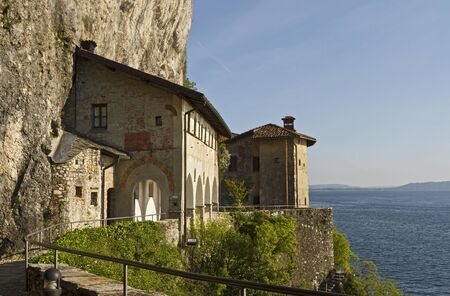 Hermitage of Santa Caterina del Sasso, built on a cliff overlooking the lake Maggiore.の写真素材
