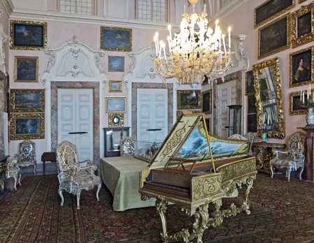 An ornate harpsichord in the Music Room of Borromean Palace, Isola Bella, Italy.