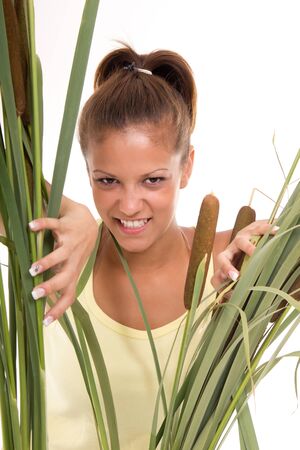 wild woman breaks through the bushesの写真素材