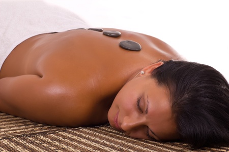 Relaxed smiling woman lying on the massage tableの写真素材