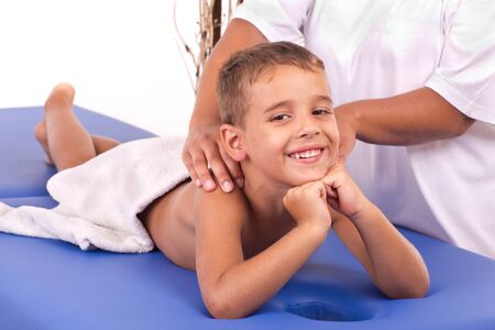 young smiling boy and his therapistの写真素材