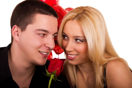 Young happy couple with roseの写真素材