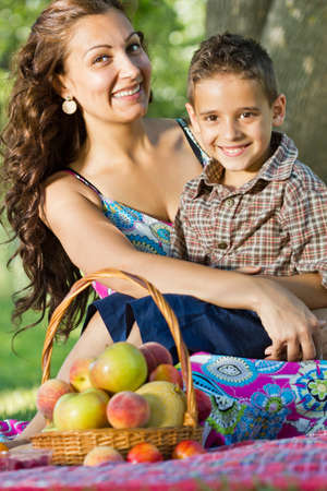 beutiful Mother holding son  outdoors smilingの写真素材