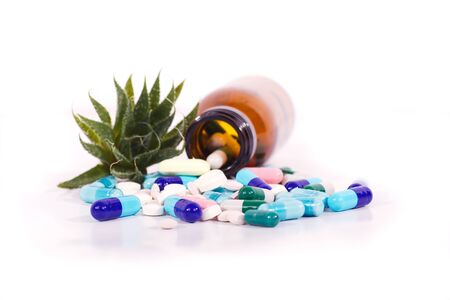 medical pills spilled from a bottleの写真素材