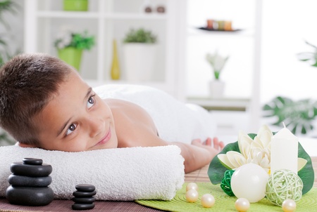 boy ready for  massage in the spa salonの写真素材