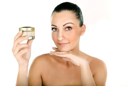woman holding cosmetic cream in her handsの写真素材