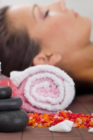 woman in spa salon,fokus on spa stonesの写真素材