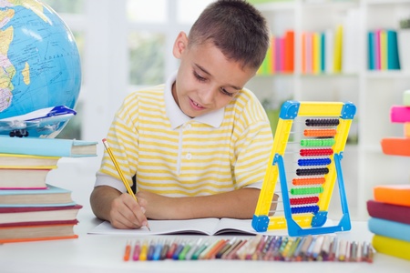 young boy learning at homeの写真素材