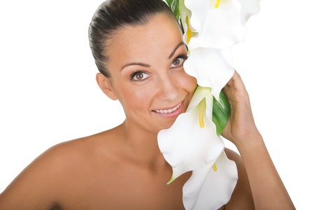 beautiful woman holding flowers on the faceの写真素材