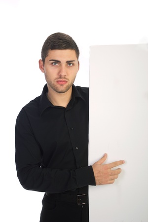 young bussinesman pointing white cardの写真素材