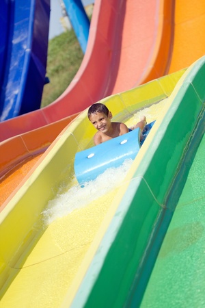 little boy in aquapark enjoysの写真素材