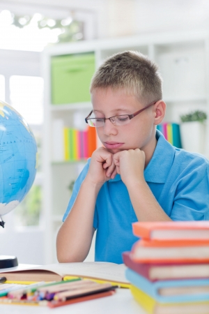 little blue boy thinking の写真素材