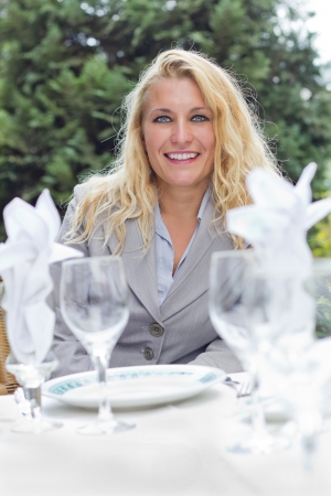 blonde beautiful woman in restaurantの写真素材