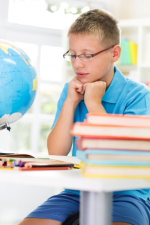 Blonde boy studyingの写真素材