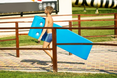Boy walking in aqua park の写真素材