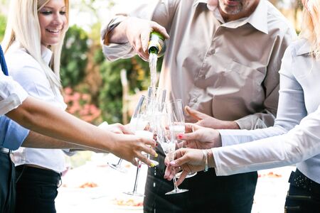 Group of people having a toast の写真素材