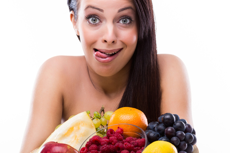 Beautiful woman with fresh fruitの写真素材