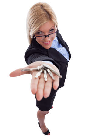 Beautiful young woman smiling and holding her keysの写真素材