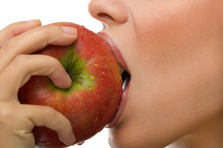  young healthy woman eating appleの写真素材