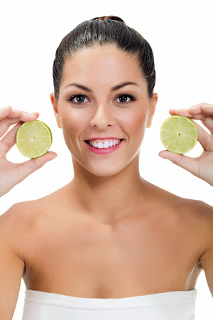 beautiful young woman with lemonの写真素材