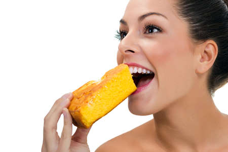 young woman eating a macrobiotic pieの写真素材