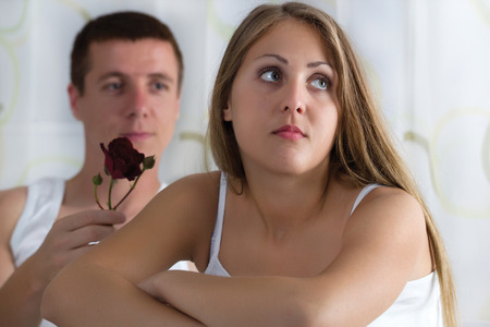 boy gives a rose to a girl,girl is angryの写真素材