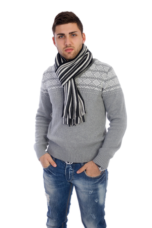 casual handsome man smiling at camera, hands in pocket  の写真素材