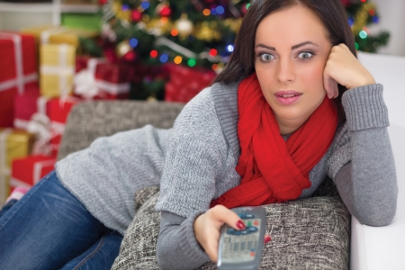 woman on Christmas Eve watching TVの写真素材