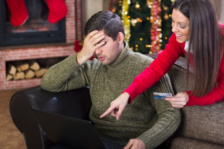 man covering his eyes with his hand because  the cost woman on Christmas nightの写真素材