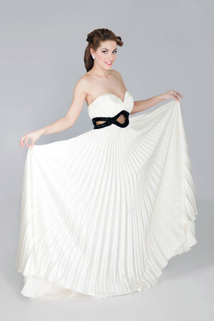 Romantic blonde beauty wearing white dress の写真素材