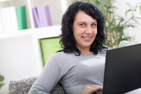 beautiful young woman at homeの写真素材