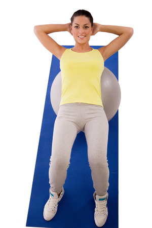 young woman exercising with exercise ballの写真素材