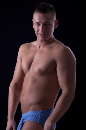 Portrait of fashion young caucasian sexy muscled attractive handsome manの写真素材