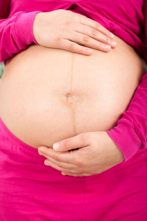 pregnant woman caressing her belly の写真素材