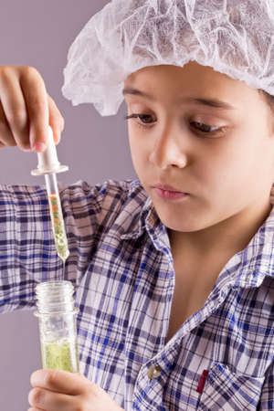 little scientist exercise  chemistry and uses a pipette and tubeの写真素材