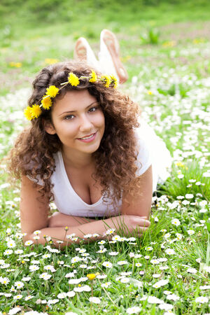 Young girl in the vild flower fieldの写真素材