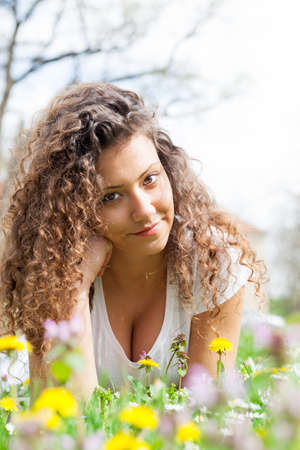  beautiful young girl in flower fieldの写真素材