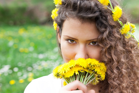 Portrait of the young beautiful smiling woman outdoors の写真素材