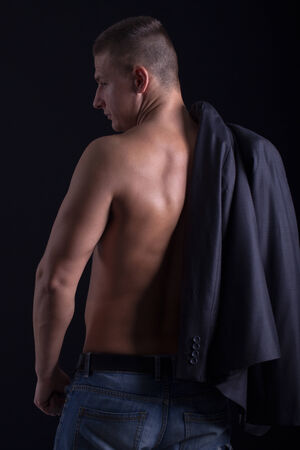 muscled male model showing his backの写真素材
