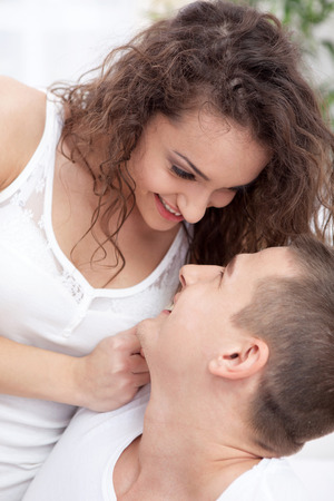 Young happy couple in love ticklesの写真素材